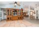 Open floor plan with tile floors connecting living room to dining room and kitchen at 1100 Oday Dr, Winter Springs, FL 32708