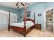 Primary bedroom featuring a four-poster bed and tiled flooring at 1100 Oday Dr, Winter Springs, FL 32708