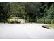 Neighborhood playground with swing set nestled amongst mature trees, perfect for to enjoy outdoor recreation at 1100 Oday Dr, Winter Springs, FL 32708