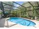 The screened-in pool is surrounded by a large deck with ample room for outdoor entertaining and lush landscaping at 1100 Oday Dr, Winter Springs, FL 32708