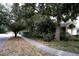 A charming street with mature trees and a sidewalk, perfect for an evening stroll at 1100 Oday Dr, Winter Springs, FL 32708
