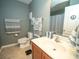 Bathroom with modern vanity, framed mirror, and decorative towels at 11742 Chateaubriand Ave, Orlando, FL 32836