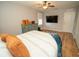 Bright bedroom featuring modern decor, ample closet space, and a large window, providing a comfortable and inviting atmosphere at 11742 Chateaubriand Ave, Orlando, FL 32836