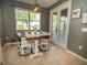 Charming breakfast nook with cozy seating and views of the backyard at 11742 Chateaubriand Ave, Orlando, FL 32836