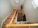 Elegant staircase with wood steps, wrought iron railings, and decorative accents, adding a touch of sophistication to the home's interior at 11742 Chateaubriand Ave, Orlando, FL 32836