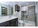 Bathroom showcasing vanity with sink and a large shower with glass doors at 11957 Vermillion Ave, Windermere, FL 34786