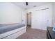 Bedroom with single bed, ceiling fan, closet and view to another room at 11957 Vermillion Ave, Windermere, FL 34786