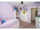 Bedroom featuring lilac colored walls, carpeted floors, closet and dresser at 11957 Vermillion Ave, Windermere, FL 34786