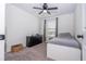 Bedroom featuring a single bed, black dresser, and a window dressed with gray curtains at 11957 Vermillion Ave, Windermere, FL 34786