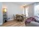 Cozy dining area with seating for four, natural light, and view of adjacent living space at 11957 Vermillion Ave, Windermere, FL 34786