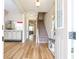 Open entryway with wood-look flooring, a staircase, and a glimpse into the home's open layout at 11957 Vermillion Ave, Windermere, FL 34786