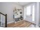 Welcoming entryway with wood-look flooring, stylish storage, and a bright front door at 11957 Vermillion Ave, Windermere, FL 34786