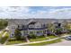 Beautiful multi-Gathering townhouse building with manicured landscaping and a well-maintained front yard at 11957 Vermillion Ave, Windermere, FL 34786
