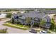 Aerial view of new construction townhomes with manicured lawns and mature landscaping at 11957 Vermillion Ave, Windermere, FL 34786