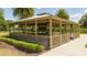 Community gazebo featuring picnic tables and a well-maintained surrounding landscape at 11957 Vermillion Ave, Windermere, FL 34786