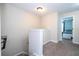 Upstairs hallway featuring neutral paint, gray carpet and access to the bedrooms at 11957 Vermillion Ave, Windermere, FL 34786
