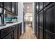 Well-organized kitchen featuring dark cabinets, light countertops, and an open layout at 11957 Vermillion Ave, Windermere, FL 34786