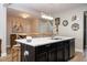 Bright eat-in kitchen boasts a quartz island and stainless steel appliances at 11957 Vermillion Ave, Windermere, FL 34786