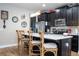 Bright kitchen features a quartz island, stainless appliances, and modern decor at 11957 Vermillion Ave, Windermere, FL 34786