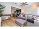 Open-concept living room showcases wood floors, kitchen and dining areas at 11957 Vermillion Ave, Windermere, FL 34786