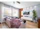 Bright and airy living room with large windows and a modern entertainment center at 11957 Vermillion Ave, Windermere, FL 34786