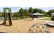 Community playground with slide and swings, dome, and merry-go-round at 11957 Vermillion Ave, Windermere, FL 34786