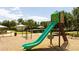 Community playground with slide and swings adjacent to pool, restrooms, and outdoor grills at 11957 Vermillion Ave, Windermere, FL 34786