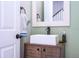 Chic powder room featuring a stylish vanity, modern faucet, and fresh design at 11957 Vermillion Ave, Windermere, FL 34786