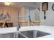 Close up of the kitchen sink with modern faucet and quartz countertop at 11957 Vermillion Ave, Windermere, FL 34786