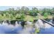 Breathtaking aerial view of a lakeside home with a private dock and lush landscaping at 12454 S Lake Mary Jane Rd, Orlando, FL 32832