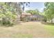 Spacious backyard featuring a screened lanai, offering an ideal outdoor living space at 12454 S Lake Mary Jane Rd, Orlando, FL 32832