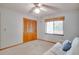 Bright bedroom with a comfortable futon, a window and ample closet space at 12454 S Lake Mary Jane Rd, Orlando, FL 32832