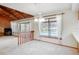 Bright dining area showcasing a vaulted ceiling and a scenic view of the outdoor pool and landscape at 12454 S Lake Mary Jane Rd, Orlando, FL 32832