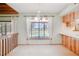 Bright dining area featuring views of the pool and a wooded back yard at 12454 S Lake Mary Jane Rd, Orlando, FL 32832