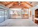 Bright living area with vaulted ceilings, access to the outdoor patio, and views into the modern kitchen at 12454 S Lake Mary Jane Rd, Orlando, FL 32832