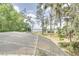 Screened pool enclosure offers views of a lake bordered by mature trees at 12454 S Lake Mary Jane Rd, Orlando, FL 32832