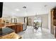 Kitchen and dining area with tile floors, granite counters, and stainless appliances at 13054 Prairie Meadows Dr, Orlando, FL 32837