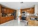 Updated kitchen with stainless steel appliances, granite countertops and tile flooring at 13054 Prairie Meadows Dr, Orlando, FL 32837
