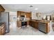 Renovated kitchen features stainless steel appliances, granite countertops, and ample cabinetry at 13054 Prairie Meadows Dr, Orlando, FL 32837