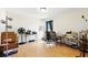 Versatile office space or bedroom offers natural light, a ceiling fan, and laminate wood flooring at 13054 Prairie Meadows Dr, Orlando, FL 32837
