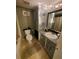 Updated bathroom with unique wall tiling and decorative fixtures at 131 Water Front Way # 200, Altamonte Springs, FL 32701