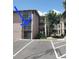 Multi-story condo building featuring screened balconies, parking and pedestrian access, surrounded by lush trees and landscaping at 131 Water Front Way # 200, Altamonte Springs, FL 32701