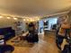 Cozy living room with tile floors, featuring unique decor, and ample space connected to the kitchen at 131 Water Front Way # 200, Altamonte Springs, FL 32701