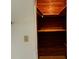 Spacious wooden closet with built in shelving and clothing rod at 1399 Aloma Ave, Winter Park, FL 32789