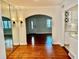 Open dining space with hardwood floors seamlessly flowing into the kitchen area at 1399 Aloma Ave, Winter Park, FL 32789