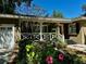 Welcoming exterior view showcasing landscaped garden, covered porch, and vibrant curb appeal at 1399 Aloma Ave, Winter Park, FL 32789