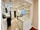 Modern kitchen with white cabinetry, quartz countertops, and stainless steel appliances at 1399 Aloma Ave, Winter Park, FL 32789