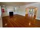 Spacious living room featuring hardwood floors, built-in shelves, and an open layout at 1399 Aloma Ave, Winter Park, FL 32789