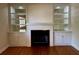 Elegant fireplace with built-in shelving, adding character and charm to the living space at 1399 Aloma Ave, Winter Park, FL 32789