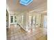 Sun room features tile flooring and multiple access points to the exterior and a skylight at 1399 Aloma Ave, Winter Park, FL 32789